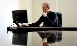 guy reading tips to start a personal investment company