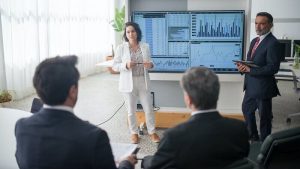 man and woman presenting at work