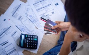 A Man Holding Credit Cards