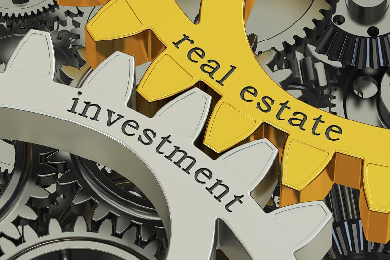Investment and real estate written on gears