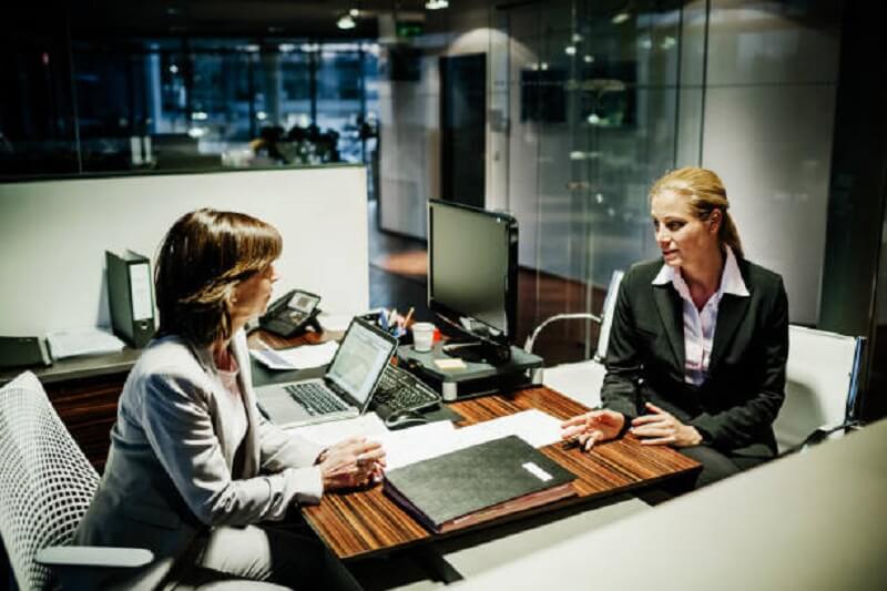 two woman in a meeting