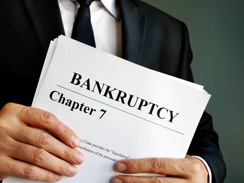 lawyer holding bankruptcy papers