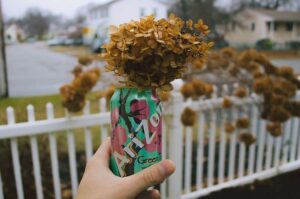 man hand holding AriZona Tea