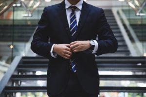 man wearing black pent coat