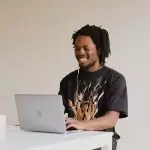 Black person using laptop