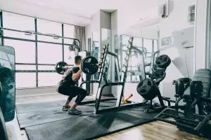 man doing exercise in Gym