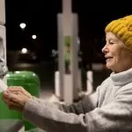 smiley woman in the gas station