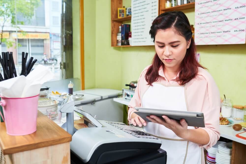Girl Setup a Cash Register Machine