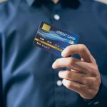 person holding credit card