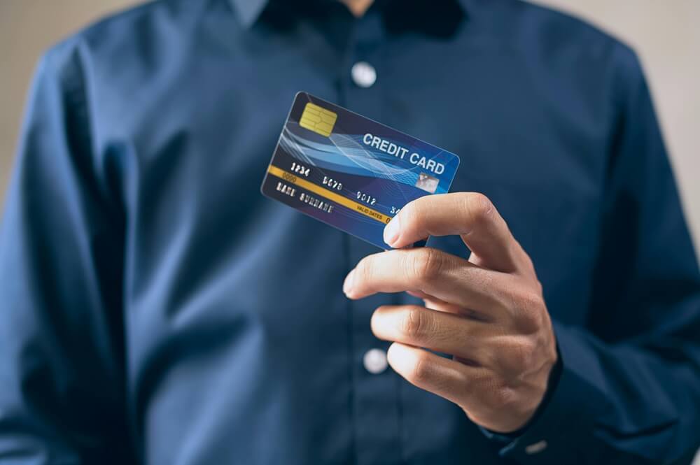 person holding credit card